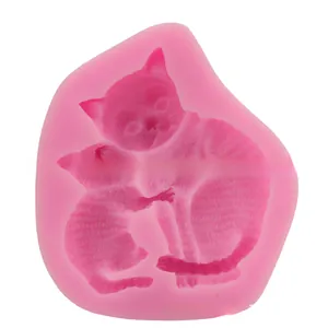 Pink silicone mold detail showing mother and kitten cat embossed patterns for DIY baking