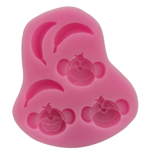 Pink silicone mold featuring monkey and banana shapes for DIY cake fondant and baking