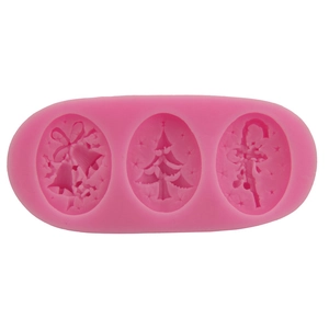Pink silicone Christmas mold with bell, tree, and candy cane shapes for DIY baking