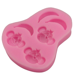 Pink silicone monkey and banana shaped mold for DIY cake baking and fondant crafting