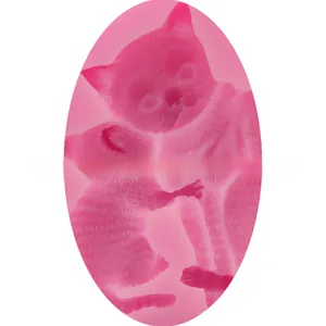 Pink silicone DIY mold featuring cute cat relief details for baking and soap making