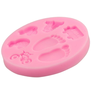 Pink silicone baby-themed baking mold for fondant and chocolate featuring small feet shapes