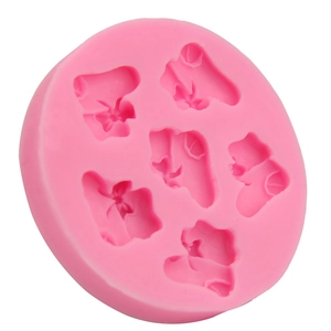 Pink silicone cake mold with six detailed ballet slipper shapes for DIY baking and crafts