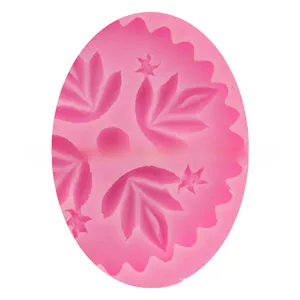 Macro shot of pink silicone leaf and star patterns for DIY cake decorating mold