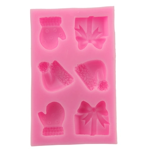 Pink Christmas silicone mold featuring gloves, hats, and gift box shapes for DIY baking