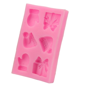Pink silicone Christmas baking mold with 6 cavities featuring gloves, hats and bows