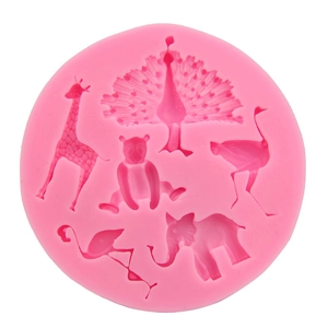 Pink silicone mold featuring peacock giraffe elephant and flamingo for cake decorating