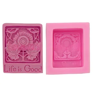 Detail view of pink silicone sunflower molds with Life is Good text for soap making