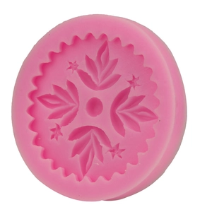 Pink round silicone mold featuring leaf and star relief patterns for DIY fondant baking