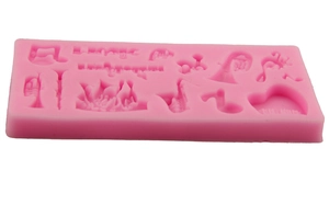 Pink silicone musical instrument cake mold with Happy Birthday text and jazz theme shapes
