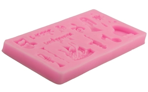Pink silicone fondant mold featuring musical instruments like piano, saxophone and notes