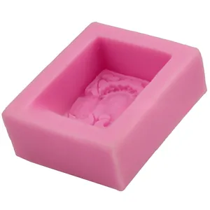 Close-up of pink rectangular silicone sunflower mold with spiral floral texture for DIY