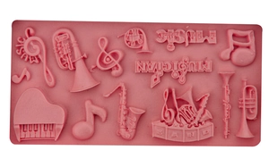 Pink music themed silicone fondant mold featuring piano and saxophone instrument shapes