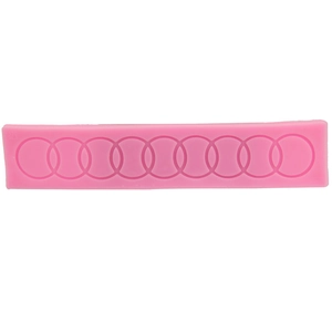 Pink silicone mold featuring eight interlocking circles for DIY cake borders and crafts