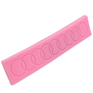 Pink silicone cake mold for DIY round ring patterns and fondant baking decoration