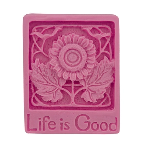 Pink silicone sunflower mold with Life is Good text for soap making and baking