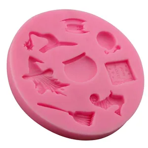 Pink silicone mold featuring Halloween witch, broom, cauldron, and magic book patterns