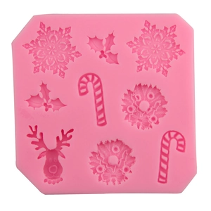 Pink Christmas silicone mold with reindeer, snowflakes and candy canes for DIY baking