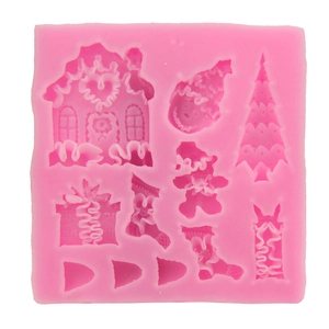 Pink silicone Christmas tree and gingerbread house mold for chocolate and fondant baking
