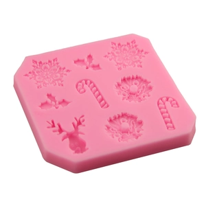 Pink silicone Christmas mold with reindeer, snowflakes and candy canes for DIY baking