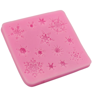 Molde de silicona rosa con copos de nieve para decoración de pasteles y repostería creativa