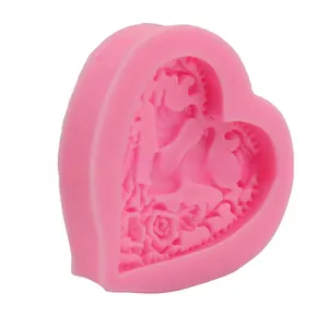 Detailed relief flower pattern inside a pink heart-shaped silicone fondant mold