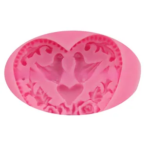 Detailed pink silicone mold featuring embossed bird heart and rose flower patterns