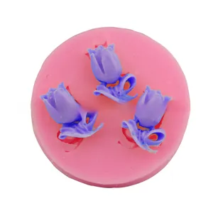 Detailed close-up of pink silicone tulip mold with finished flower soap inside