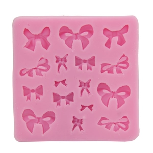 Pink silicone bow mold for DIY fondant cake baking decoration with multiple designs
