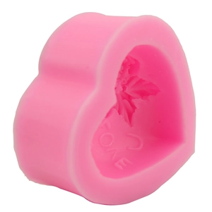 Pink heart-shaped silicone mold with LOVE letters and flower patterns for baking