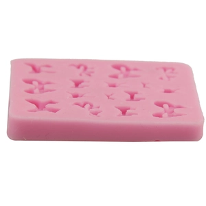 Pink silicone bow mold tray for DIY fondant cakes and chocolate baking projects