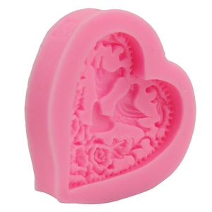Pink heart-shaped silicone mold featuring embossed female figure and rose floral details