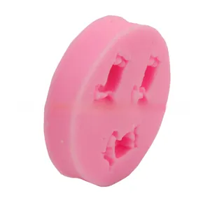 Pink silicone mold featuring three rectangular slots for DIY chocolate and soap crafting