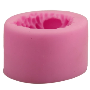 Pink silicone round mold featuring a detailed 3D flower pattern for DIY baking and crafts