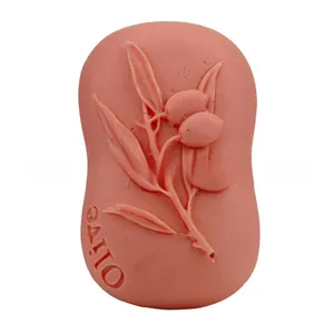 Detail view of pink olive soap showing embossed leaf pattern and Olive text engraving