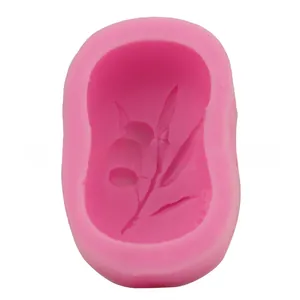 Detailed macro view of a pink silicone mold with an intricate olive branch leaf design