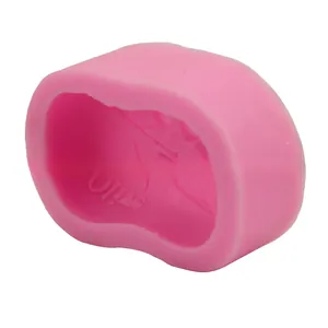 Detailed macro view of pink silicone olive leaf mold with embossed interior design