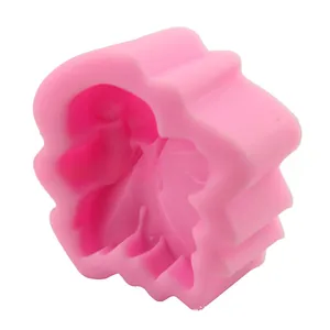Close-up of pink silicone maple leaf and cute mouse cake mold for DIY baking tools