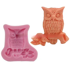 Detail view of pink silicone owl mold showing intricate owl and branch texture for baking