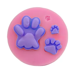 Macro detail of pink and purple silicone mold featuring three animal paw print shapes