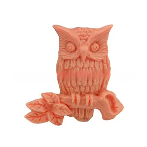 Detailed pink owl silicone cake mold featuring intricate feather textures and branch base