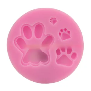 Pink silicone mold featuring various animal paw print shapes for DIY baking and crafts