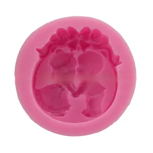 Detailed pink silicone mold featuring a wedding couple silhouette and heart patterns