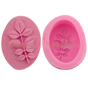 Macro shot of pink silicone leaf mold showing detailed veins and finished 3D resin relief