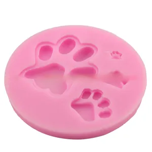 Detailed macro view of pink silicone mold with various animal paw print designs