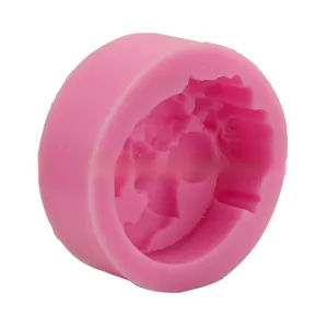 Detailed close-up of pink silicone fondant mold with intricate relief patterns