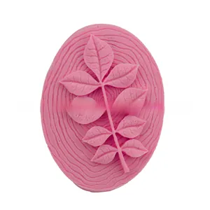 Detail of pink silicone leaf mold with intricate textures for fondant and soap making