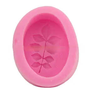 Macro detail of leaf-patterned pink silicone mold for fondant and DIY cake baking craft