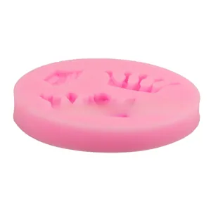 Detailed macro view of pink silicone DIY mold with multiple 3D royal crown designs