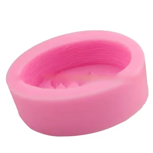 Detailed macro view of pink silicone leaf mold showing horizontal textured interior wall